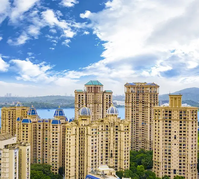 "Aerial view of Hiranandani Gardens Powai with neo-classical buildings and green spaces"