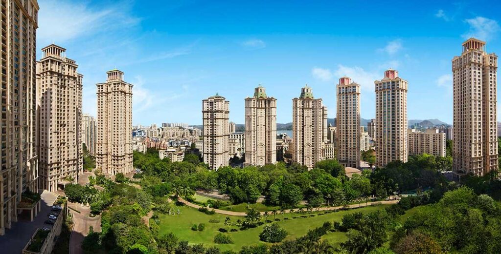 Aerial view of Powai, Mumbai showcasing modern residential complexes, green landscapes, and the neighborhood's vibrant urban charm.